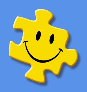 a puzzle piece that has a smiley face on it